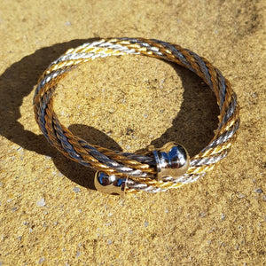 Herspirit flexible steel and gold tone bangle - approx diameter 6.5cm - Callibeau Jewellery