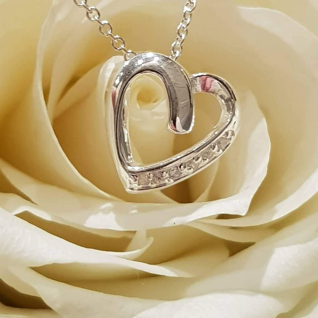 Silver, cubic zirconia classic set heart pendant on silver, trace chain 18
